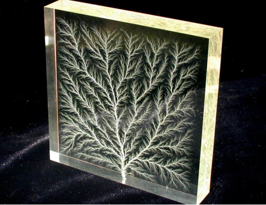 The high voltage breakdown of plexiglass creates beautiful fractal patterns called Lichtenberg figures
