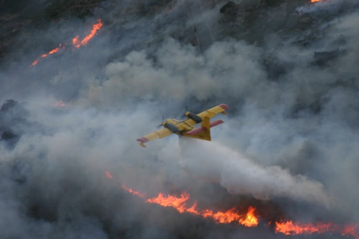 A water bomber suppressing a wildfire