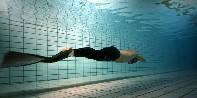 a freediver using a monofin, which is often used in Constant Weight freediving
