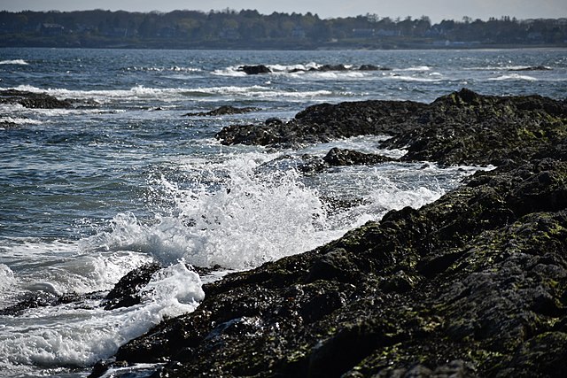 An image of ocean waves crashing onto the shore