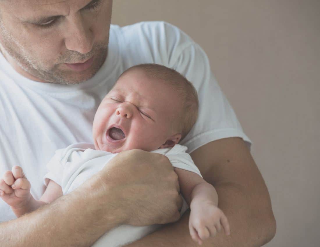 dad holding newborn