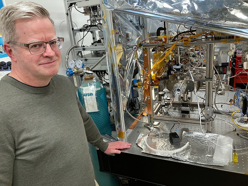 At NASA’s Goddard Space Flight Center, William Brinckerhoff stands next to a working prototype of the Rosalind Franklin rover's mass spectrometer.