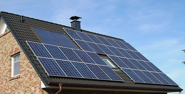 Solar panels on a roof Description automatically generated