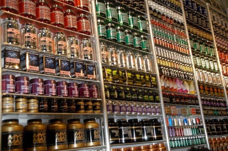 A shelf with different colored jars
Description automatically generated with medium confidence