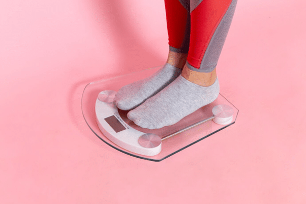 female-measuring-her-weight