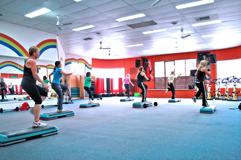 People doing aerobics at a gym