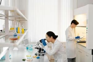 Two scientists working in a well-equipped laboratory