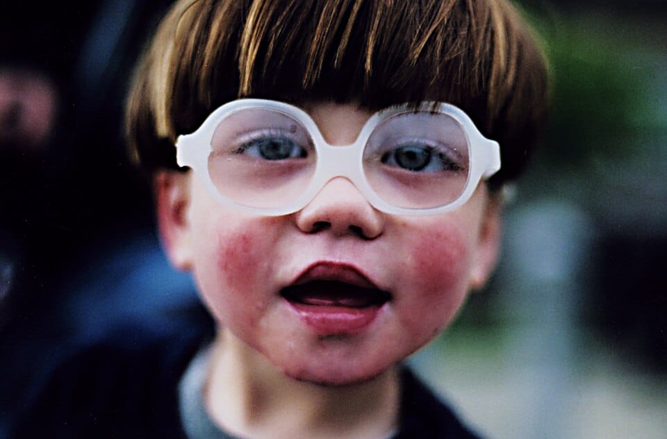 Kid with big glasses